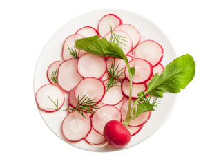 Slices of radish in a salad on plate isolated on white background