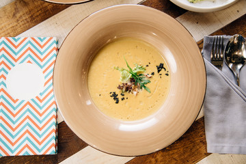 Soup. Chef's specialty presented in restaurant on served table. Clouse up. Rustic style