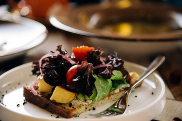 Salad. Chef's specialty presented in restaurant on served table. Clouse up. Rustic style