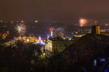 Vilnius, Lithuania January 01, 2017: Beutifull view to the main firework, at New Year night to Cathedral Square, belfry tower, Cathedral of St. Stanislaus and St. Vladislav, from hill of three crosses