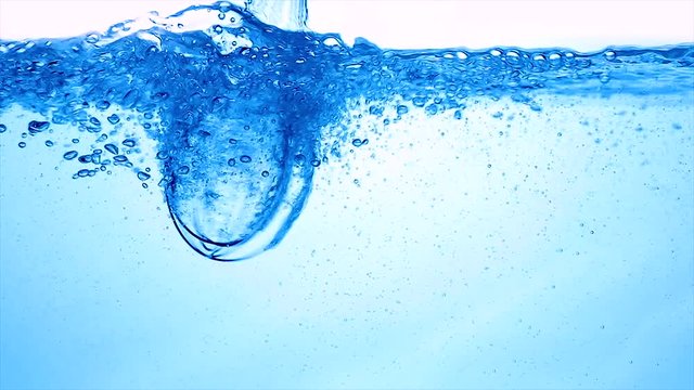 Water with a mixer whisk, slow-motion shooting.