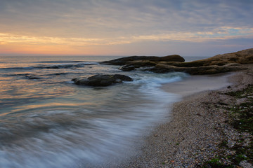 Sea sunrise at the Black Sea coast near Ravda, Bulgaria. Rocky sunrise