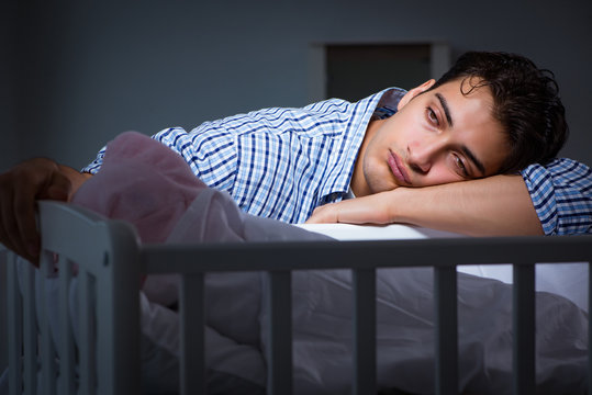 Young Father Dad Sleeping While Looking After Newborn Baby