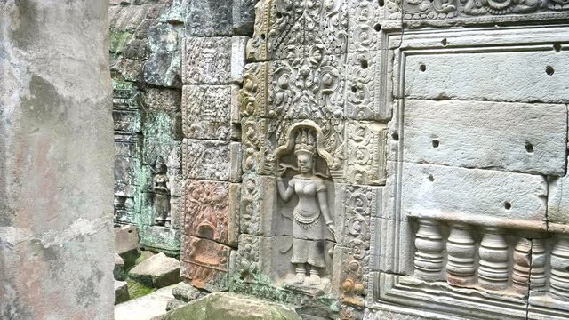 carved bas relief of a devata at preah khan temple near angkor wat, cambodia