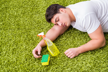 Young husband man cleaning floor at home