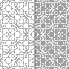 Gray and white geometric ornaments. Set of seamless patterns