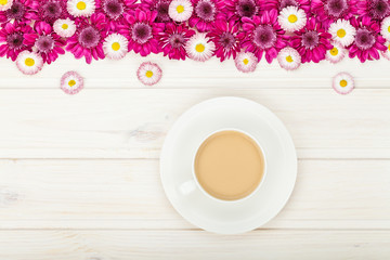 garden flowers and coffee cup on white wooden rustic table background with copy space for your text. vintage card, flat lay, top view. breakfast on Mothers day or Womens day