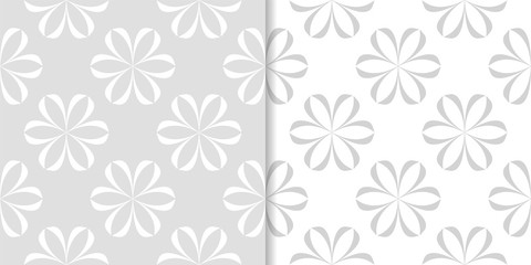 Fototapeta na wymiar Light gray floral backgrounds. Set of seamless patterns