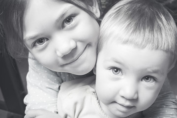 Portrait of two beautiful girls sisters