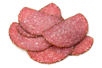 Salami slices isolated on the white background.