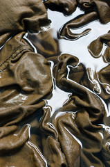 Brown Denim Fabric In Water to Washing for Abstract Background.