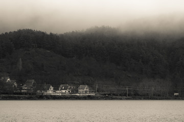 Foggy winter day at the Golcuk Lake, at Golcuk, Odemis, Izmir, Turkey. Black and white photo