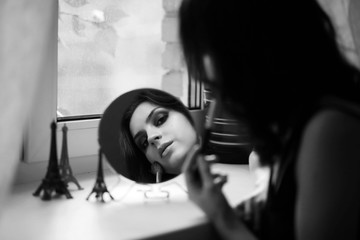 Fototapeta na wymiar Girl doing makeup black and white