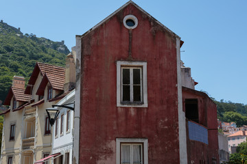 Typical Portuguese Architecture: Colorful Facade with Antique Windows - Portugal