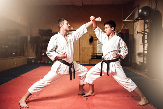 Martial arts masters, self-defence practice in gym