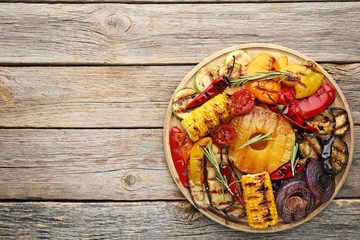 Grilled vegetable on brown cutting board