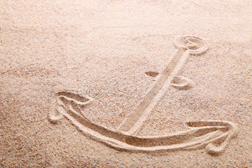 Anchor drawn on beach sand © 5second