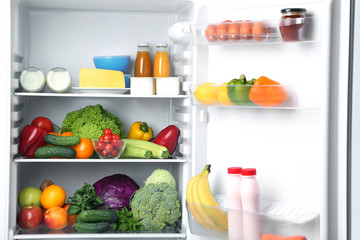 Open fridge full of vegetables and fruits © 5second