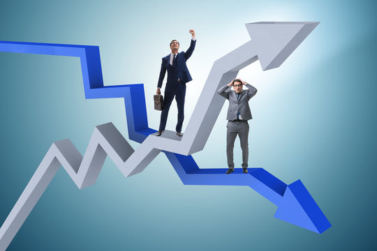 Businessman with charts of growth and decline