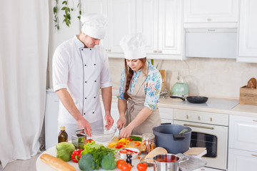 Two chefs are working together.