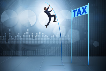 Businessman jumping over tax in tax evasion avoidance concept