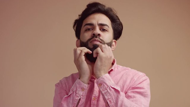 nervious stressed man making emotional surprised face touching with hands