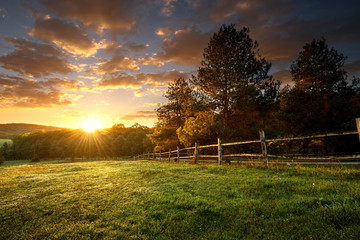 Picturesque landscape, fenced ranch at sunrise - Powered by Adobe