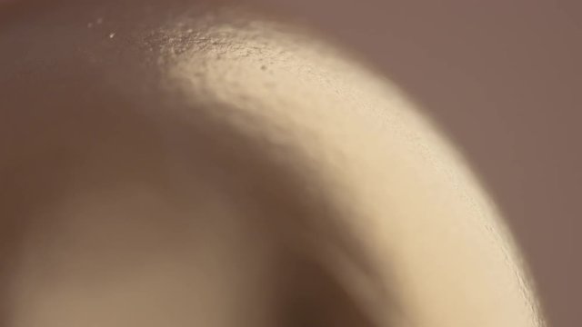 closeup of texture of golden egg's shell changing a focus point