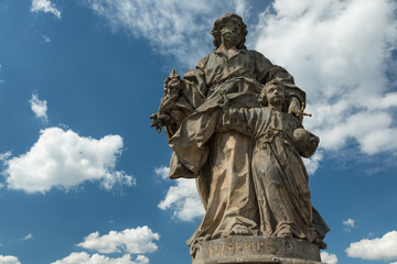 Fototapeta na wymiar Medieval statue of a saint on the old Main bridge on the old Main bridge