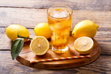 glass of lemon iced tea with fresh fruits