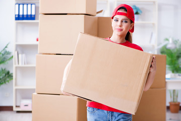 Young woman delivering boxes of personal effects