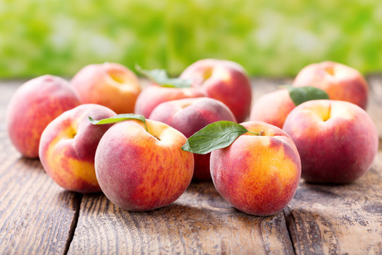 fresh peaches on a wooden table