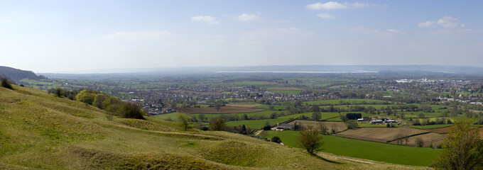 Panoramic view from Selsey Common towards the River Severn and the Forest of Dean over a patchwork of fields in The Severn Vale, Gloucestershire, UK. Stitched panorama.