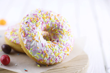 Donut on a wooden white background