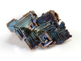 Shiny colorful mineral bismuth on a dark background