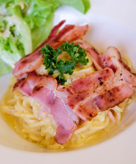 spaghetti carbonara sauce and bacon.