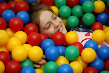 Fototapeta na wymiar A child is having fun and playing at a children's party