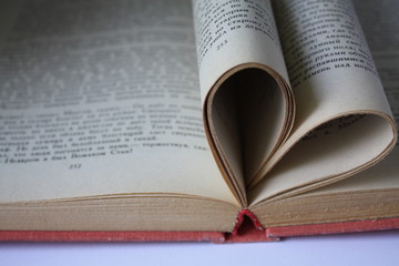 Fototapeta premium Heart shaped book pages beautiful love or reading concept photo.