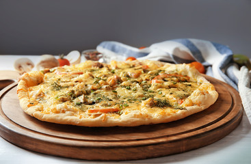 Delicious cheese pizza on wooden board. Fresh from oven