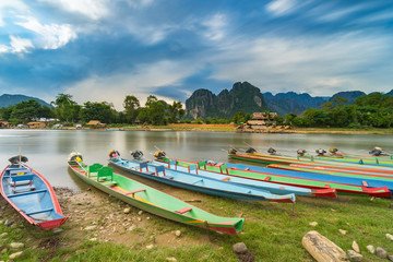 Long exposure and long tail boats on naw song river in Vang vieng, Laos.