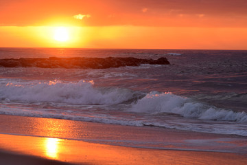 Golden Sunrise Over Crashing Waves. 