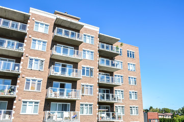 Modern condo buildings with huge windows and balconies in Montreal, Canada.