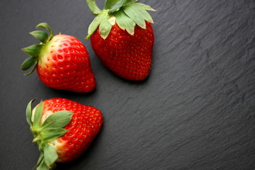 Strawberries on slate background