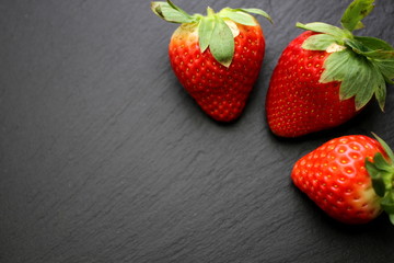Strawberries on slate background