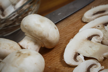Sliced ​​mushrooms lie on a cutting board
