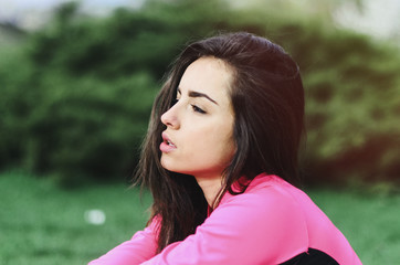 Naklejka premium a young girl goes in for sports in the fresh air . Sports clothing pink color