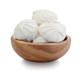 Marshmallow in a wooden bowl isolated