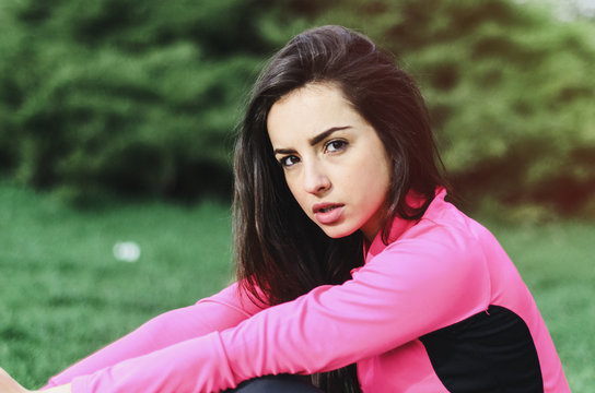 a young girl goes in for sports in the fresh air . Sports clothing pink color