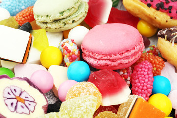 candies with jelly and sugar. colorful array of different childs sweets and treats