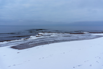 Frozen ice crystals on the sea beach